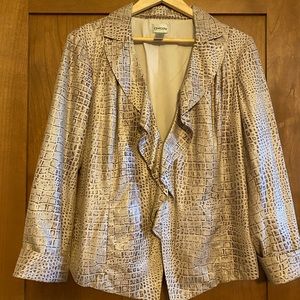 This is a very cute Chicos jacket in size large or Chicos 2 has great details.